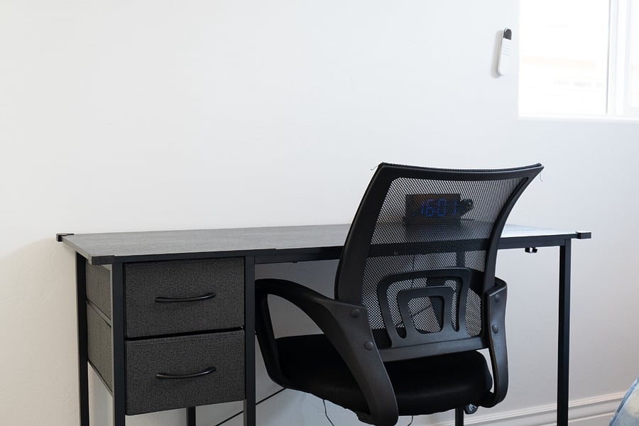 Dedicated workspace with desk and chair, ideal for remote work, studying, or planning your Tucson adventures.