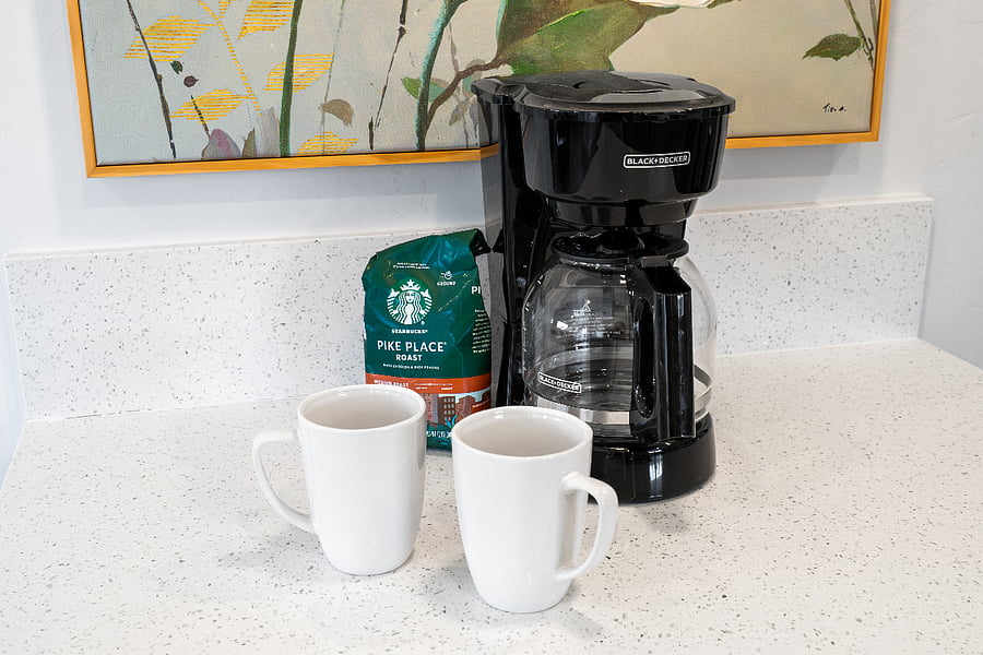 Start your morning with fresh coffee from the provided drip coffee maker and complimentary coffee supplies.