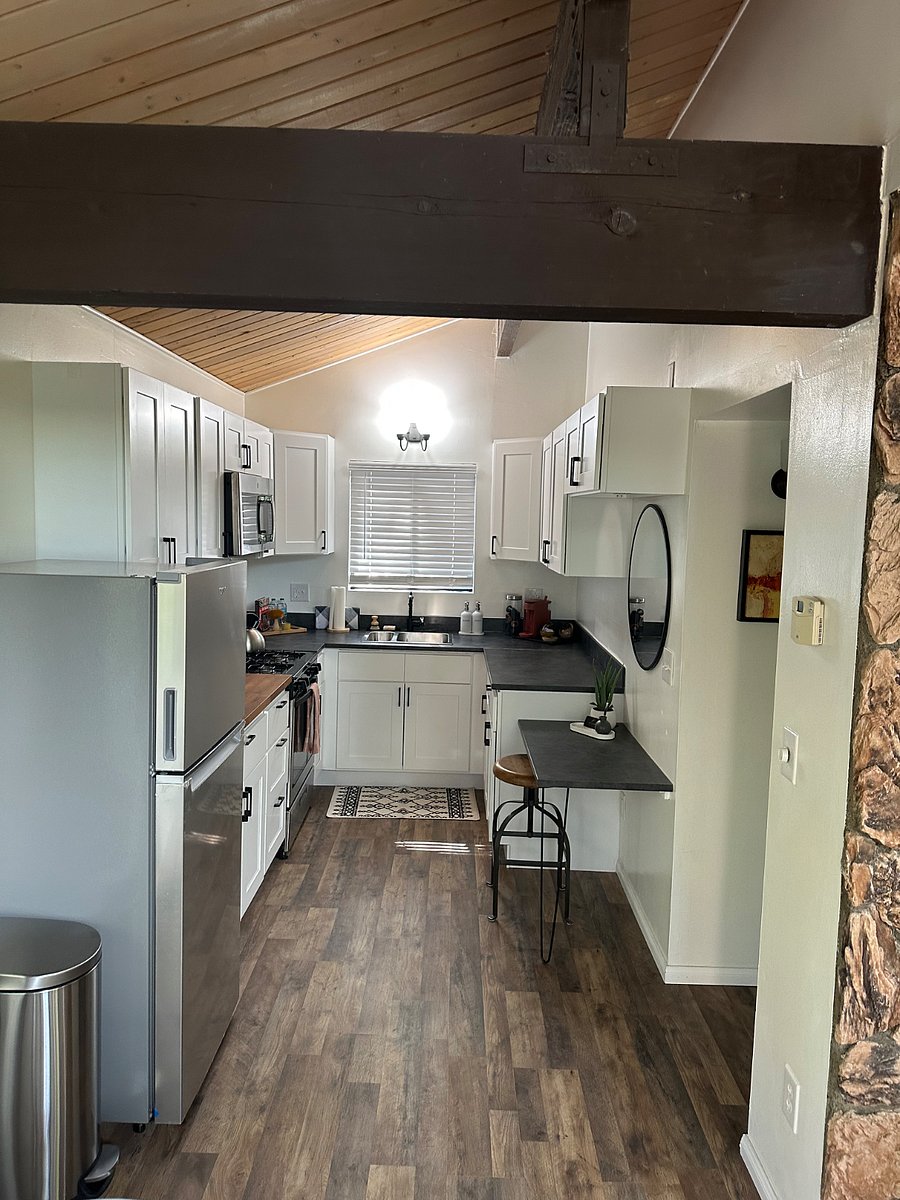 Kitchen Upstairs: Kurig Coffee Maker, Tea, Spices, Olive oil, Pots, Pans, Dishes provided