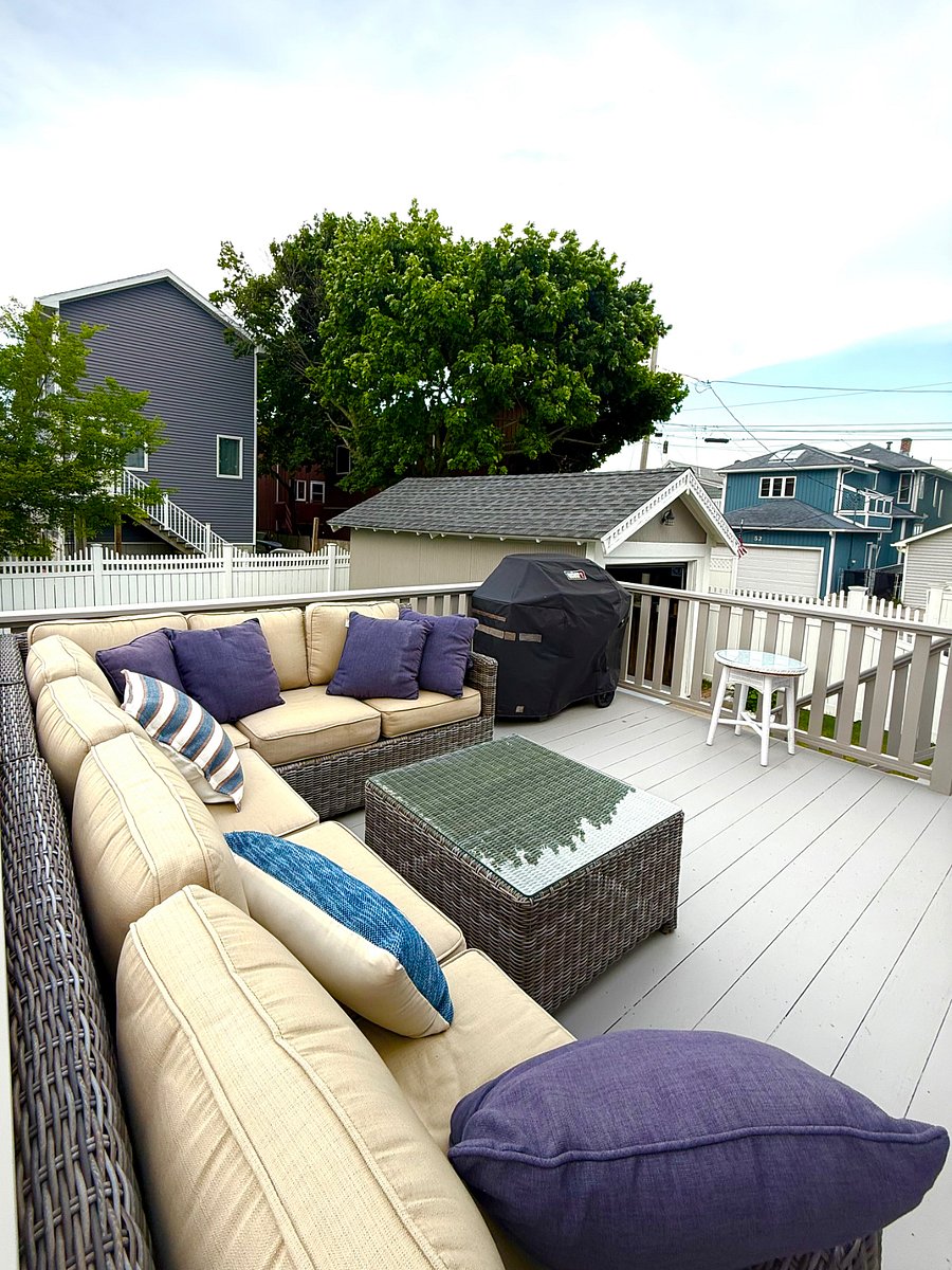Back deck with spacious furniture and new Weber Grill