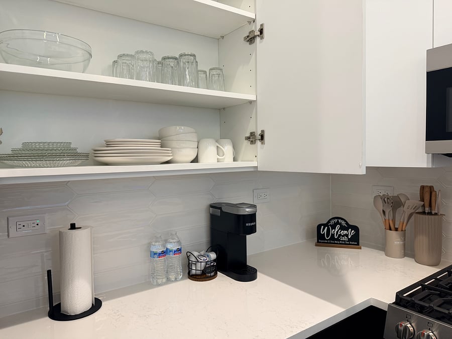 Fully equipped kitchen featuring full-size appliances, cooking essentials, and a coffee station for your morning routine.