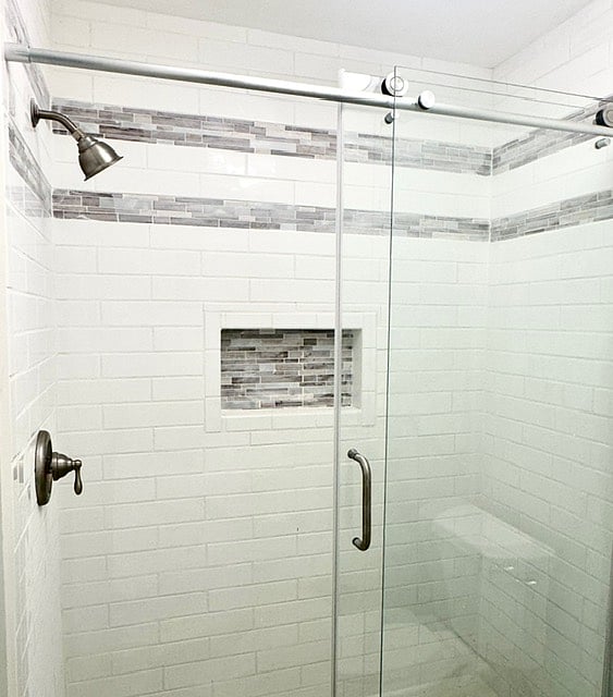 master shower with new walk in tiled shower