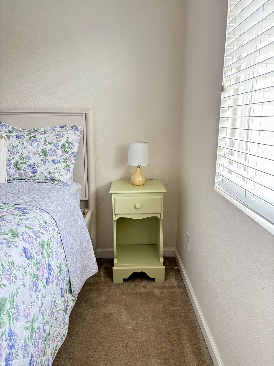 Peaceful bedroom with natural light and bedside storage