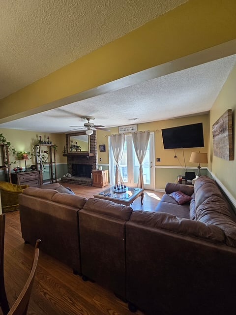 Living room with wood burning fireplace