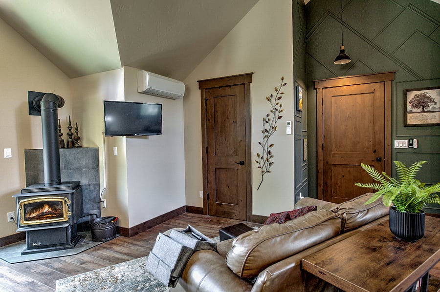 You have a sweet gas fireplace as well as a mini-split for heat and AC.  These doors include the one on the right - into your studio apartment from the downstairs entrance, and the one of the left is into the full bathroom.
