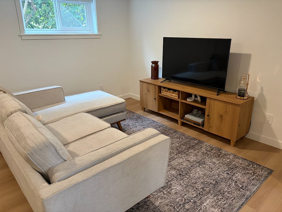 Cozy living area with Smart TV and sectional couch