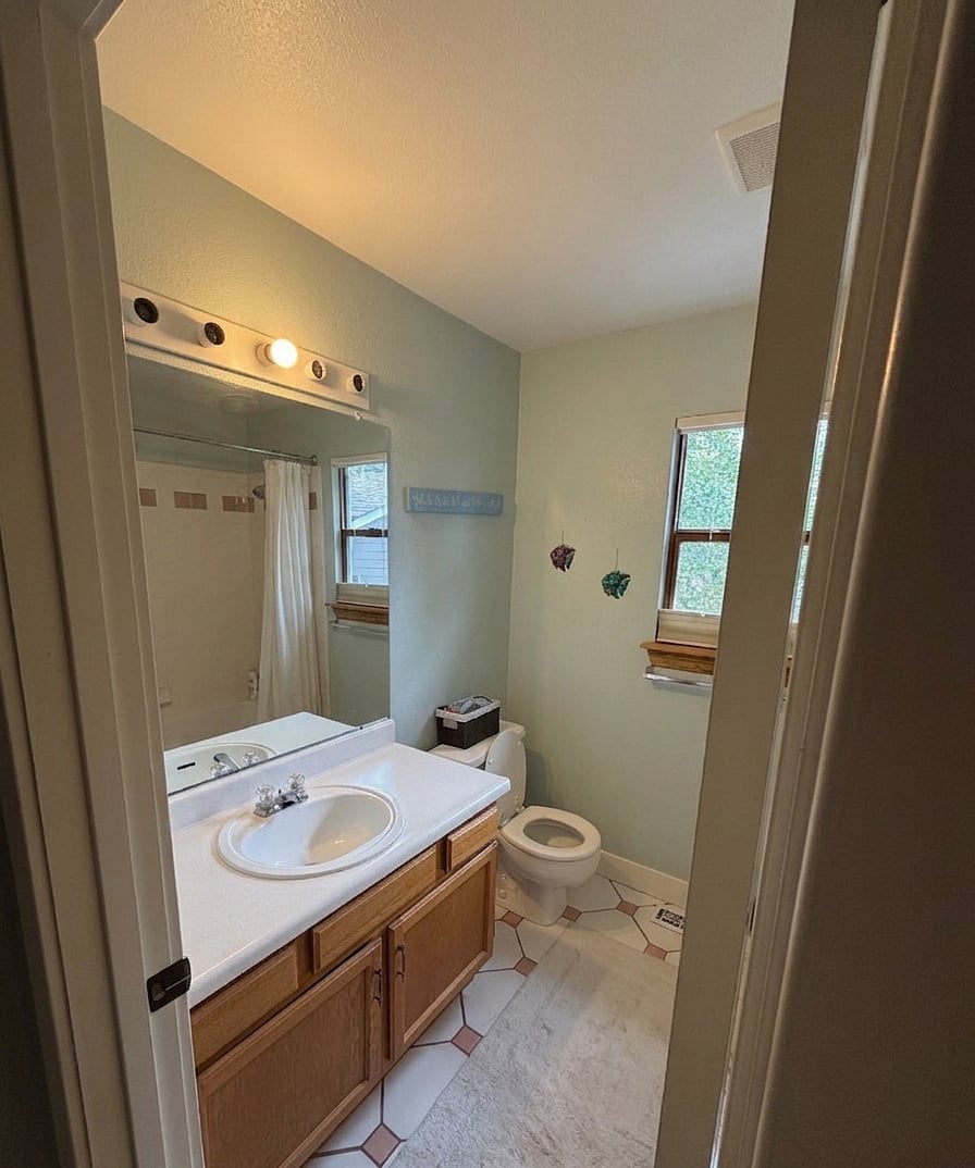Upstairs shared BA for BR2 and 3 with tub/shower.