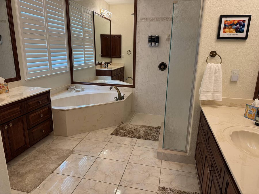 Primary bedroom has an en suite bathroom with a walk in shower and soaker tub. 