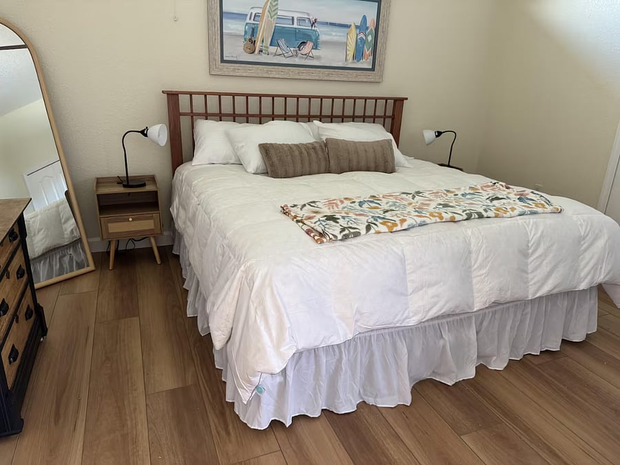 Bedroom 3 has a king sized-bed and sliding door that opens to the lanai and pool.