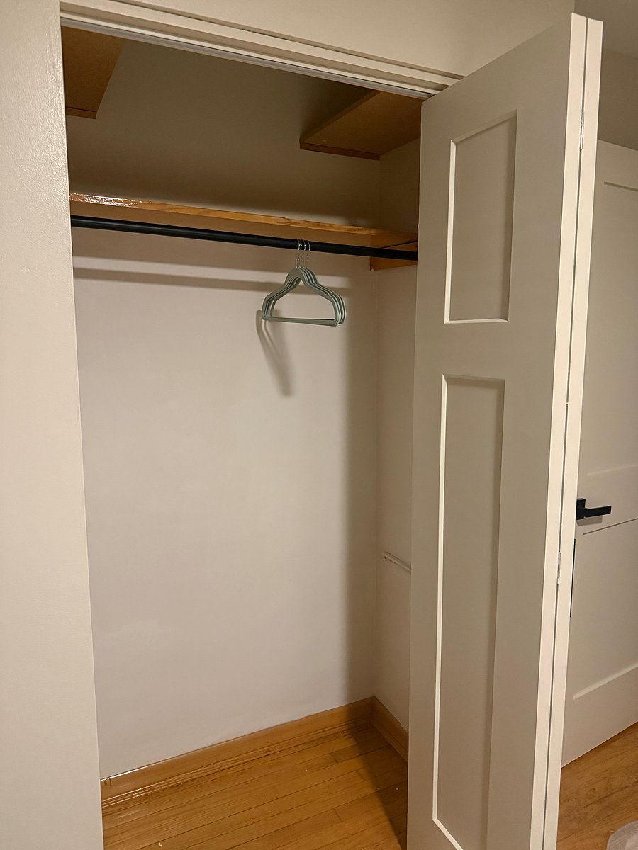 Freshly painted closet with shelf in each bedroom.