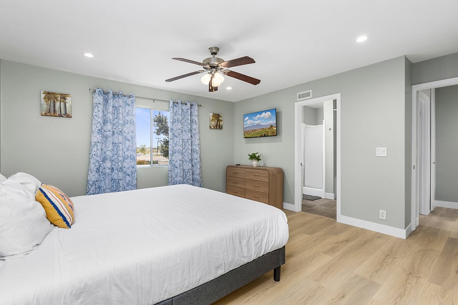 Enjoy comfort of this master bedroom with a king bed + smart TV