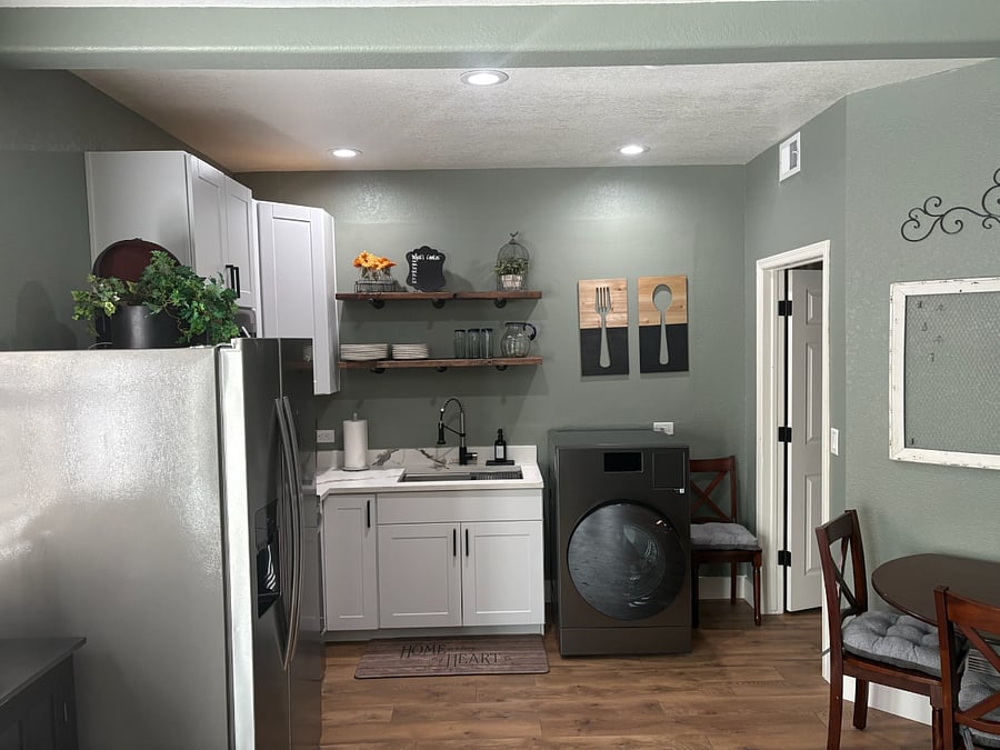 Kitchen with full refrigerator and range/oven