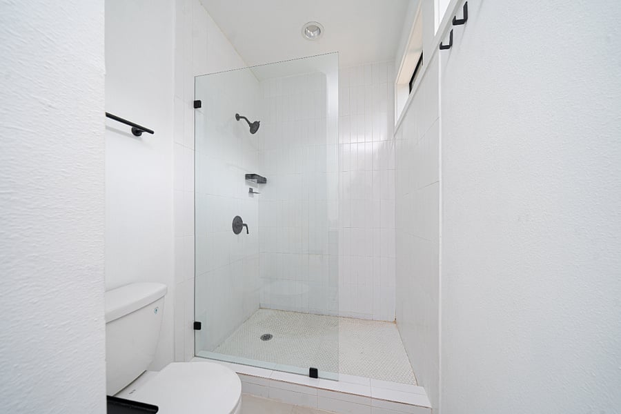 Beautiful walk-in shower with modern finishes and plenty of space to refresh after a busy day.