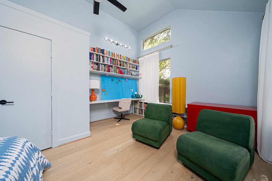 Dedicated workspace, bookshelves and comfortable seating.