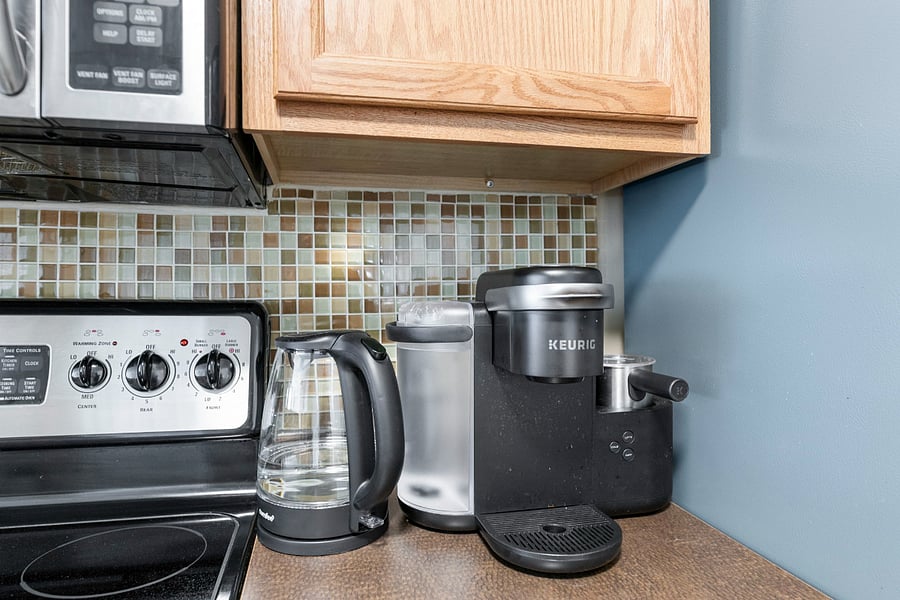 Coffee maker, hot water kettle, blender, toaster and more in fully equipped kitchen