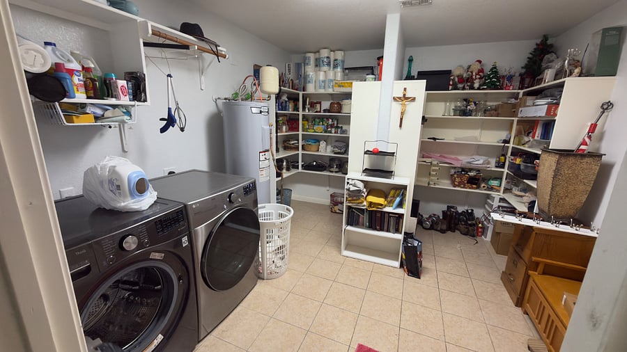 Top of the line washer and dryer at laundry room with pantry