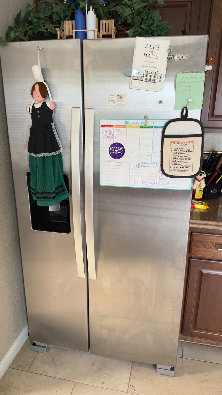 Side by side refrigerator with water and ice dispenser.