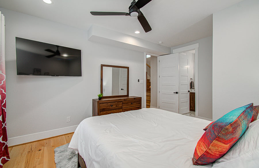 Comfortable and quiet second bedroom designed for extended stays, featuring a cozy bed, soft linens, and ample storage space. This room includes its own private bathroom, offering added comfort and privacy for family members, traveling professionals, or companions during longer stays.
