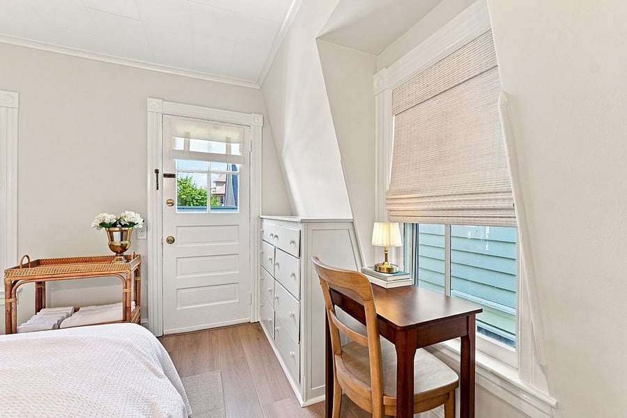 Primary Bedroom with balcony and small work station