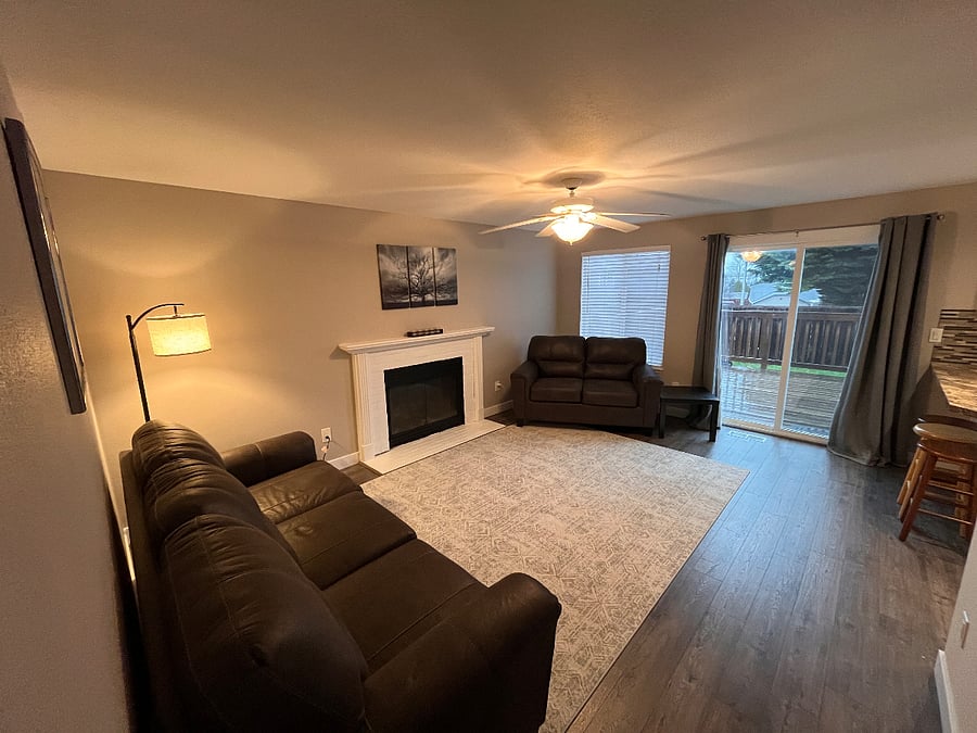 Living room, brand new couch and loveseat seat, new flooring and area rugs