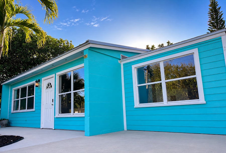 Close-up view of front entry with simple coastal cottage charm.