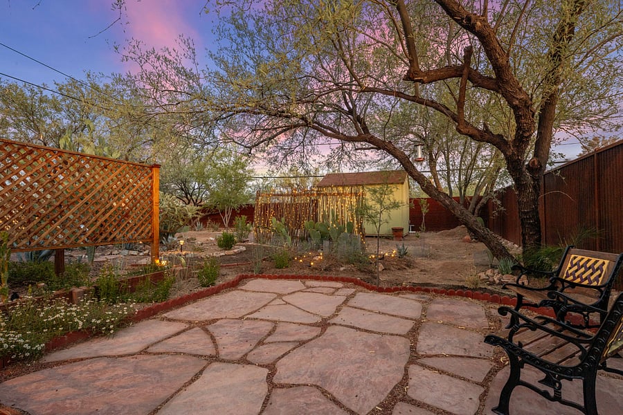 Courtyard at sunset. Evening lit solar lighting creates a warm ambiance.