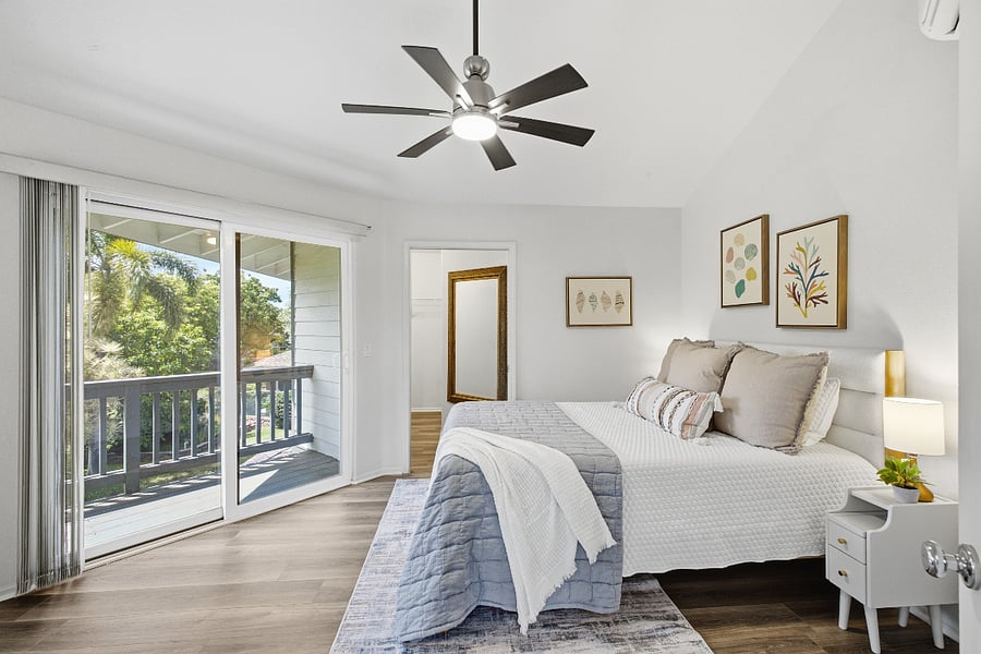 Primary bedroom upstairs with queen bed and walk-in closet