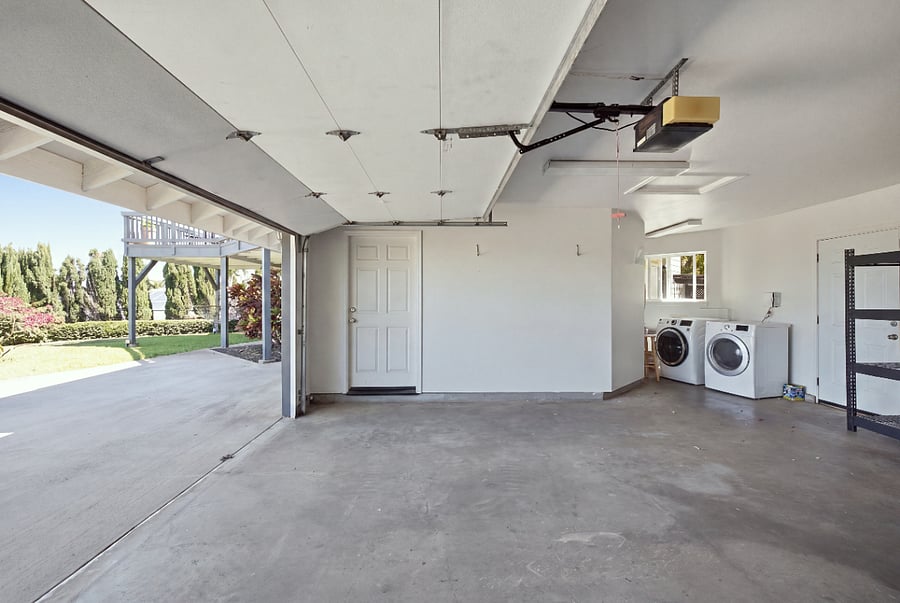 Shared 2 car garage with washer dryer and storage space