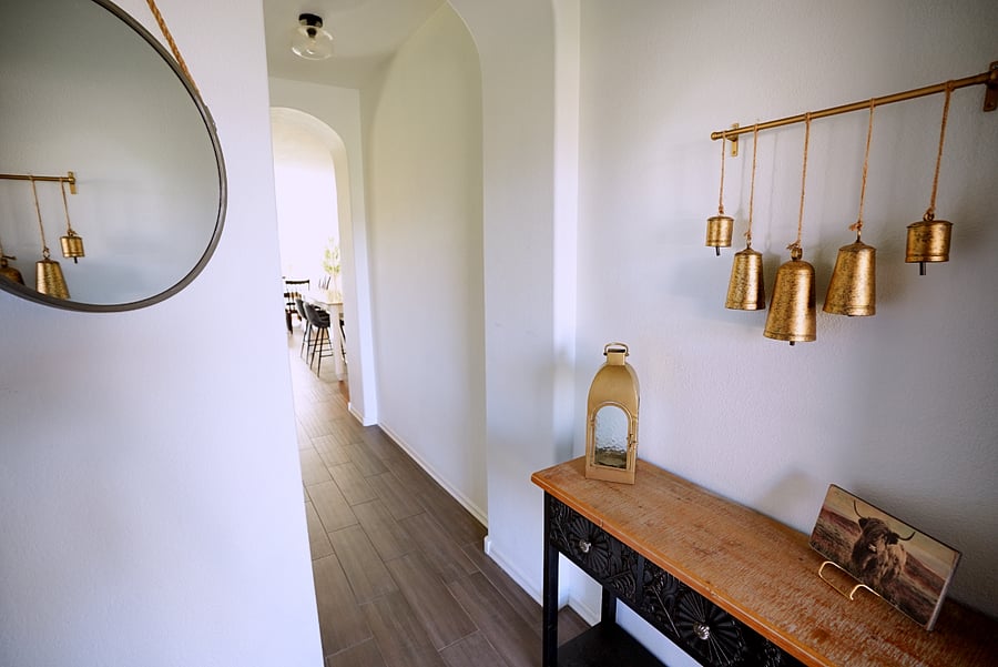 Foyer that leads into living room, dinning and kitchen. King room is to the left of the foyer creating it's own private wing.