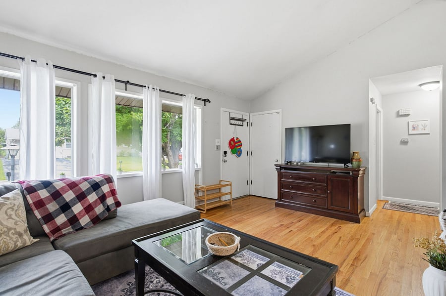 Living room with big windows, smart TV