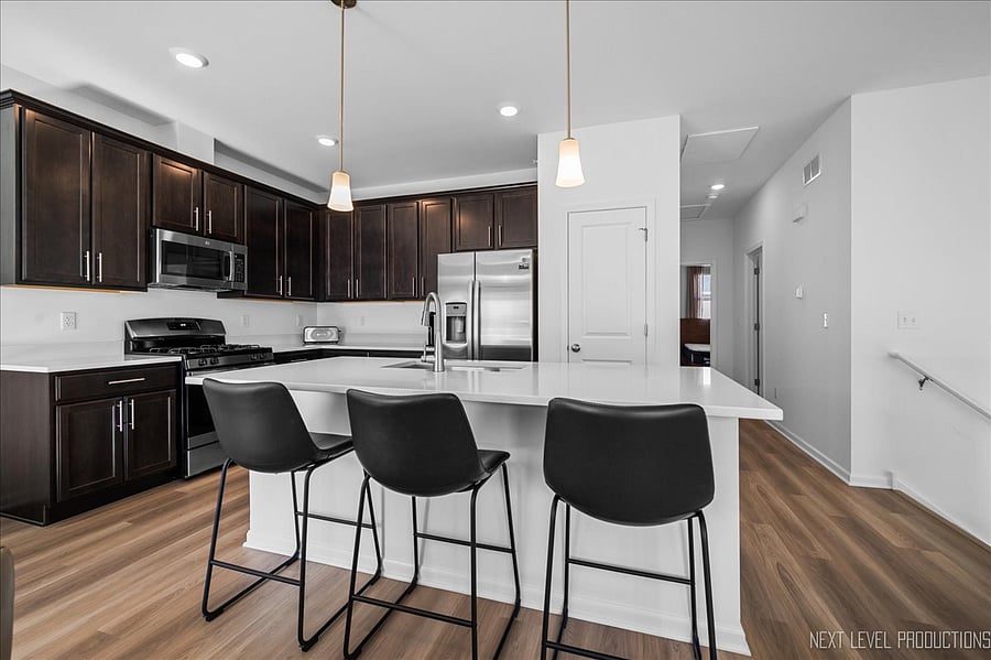 Breakfast bar w/ stools, dining table & chairs, sofa & chair, wall-mounted TV. All cooking supplies, coffee maker, all new SS appliances, ceiling fan, window treatments, etc.