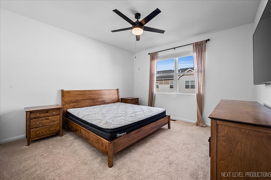 Primary bedroom, private bath, bed & side tables, wall-mounted TV, black-out shades, linens, etc.