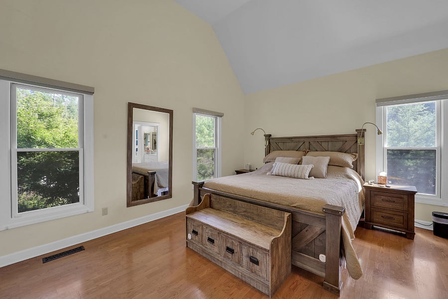 Primary Suite with a Sleep Number adjustable Split California King bed, 75" Smart TV, and smart shades