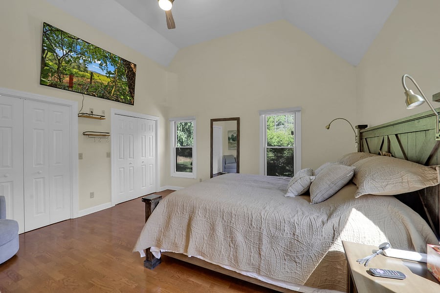 Primary Suite with a Sleep Number adjustable Split California King bed, 75" Smart TV, and smart shades
