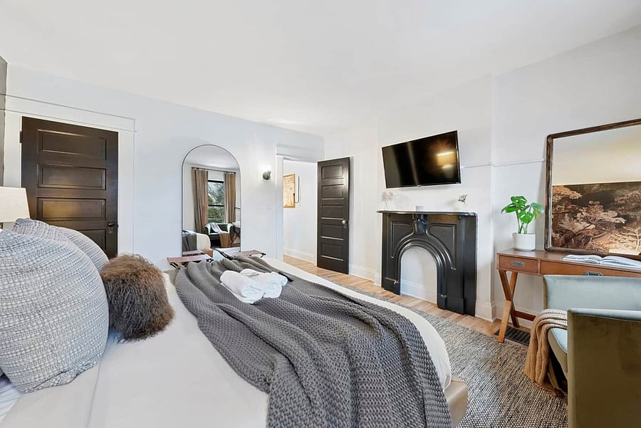 Walk in closet, desk, and tv.