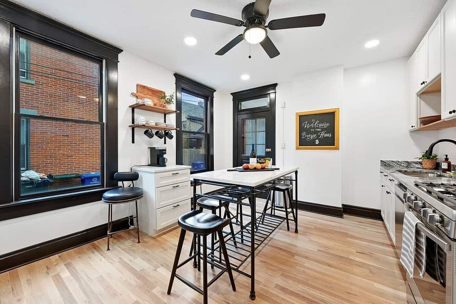 6 dining spaces in the kitchen at the island.
