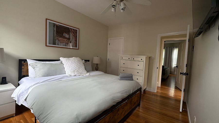 King bedroom 2 w mounted TV and closet