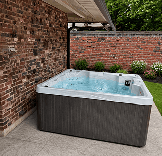 The hot tub is located with the back yard, which has 7 ft brick wall around it.