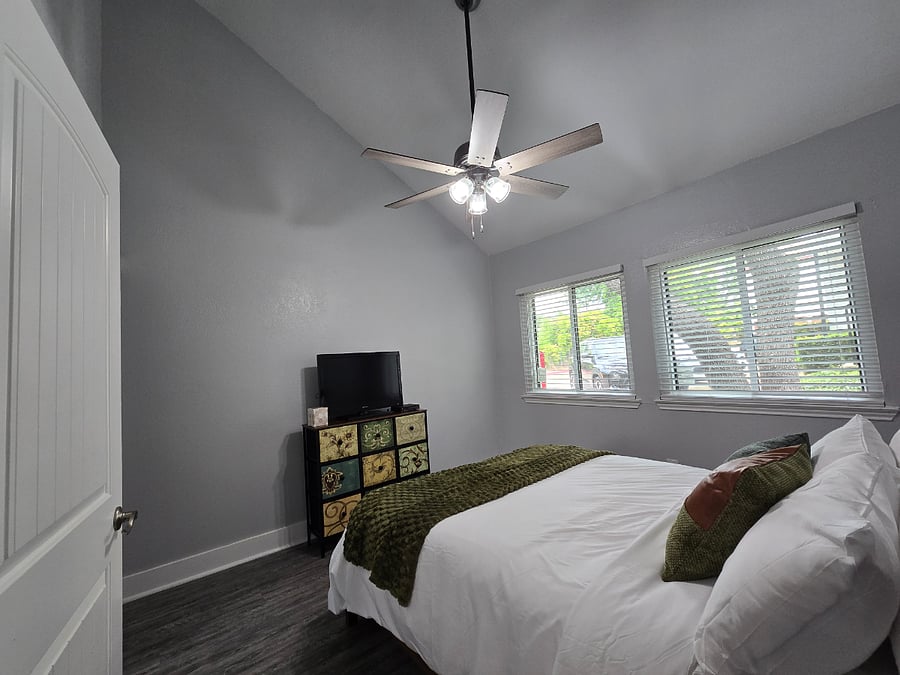 Your secondary bedroom has 18' ceilings and gorgeous natural lighting.