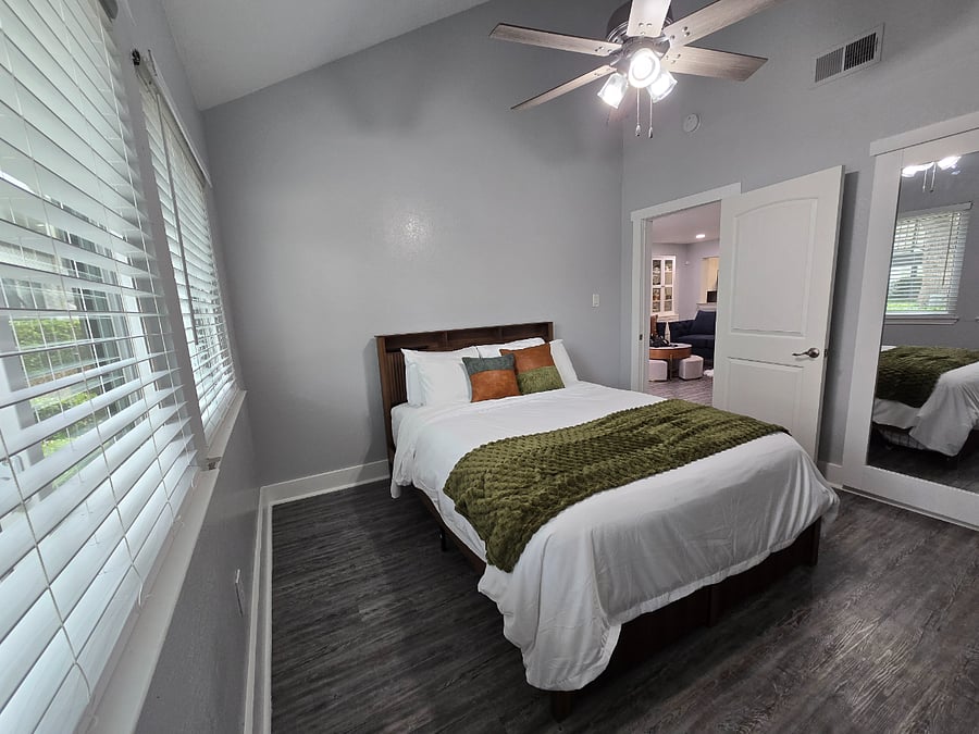 Your secondary bedroom has 18' ceilings and gorgeous natural lighting.
