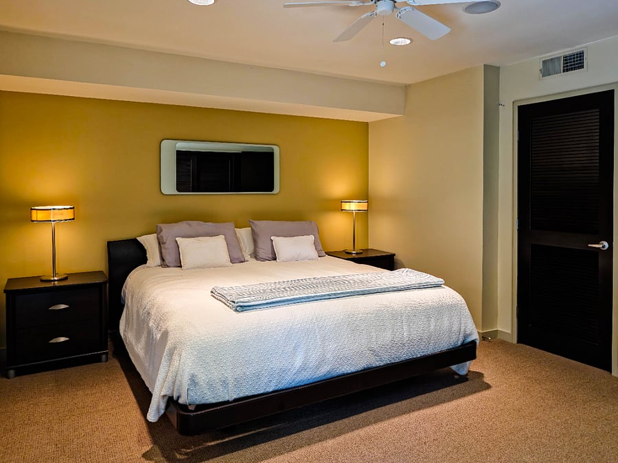 Primary bedroom with quality linens on king-sized bed to ensure a great night's sleep.