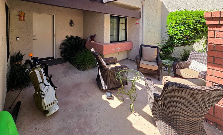 Front entry court with seating and tables.