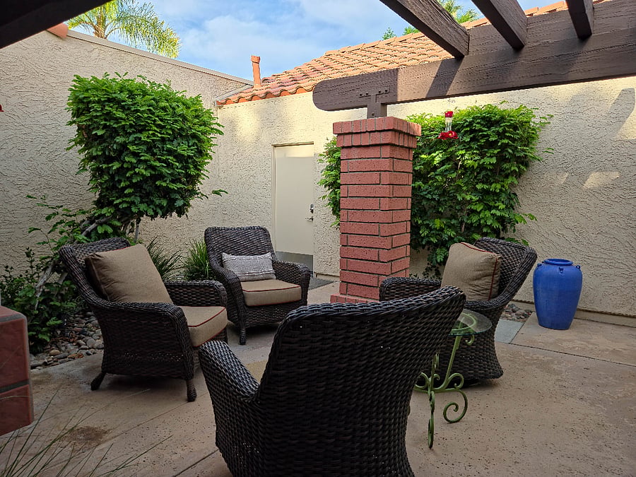 Front entry courtyard with seating and tables.