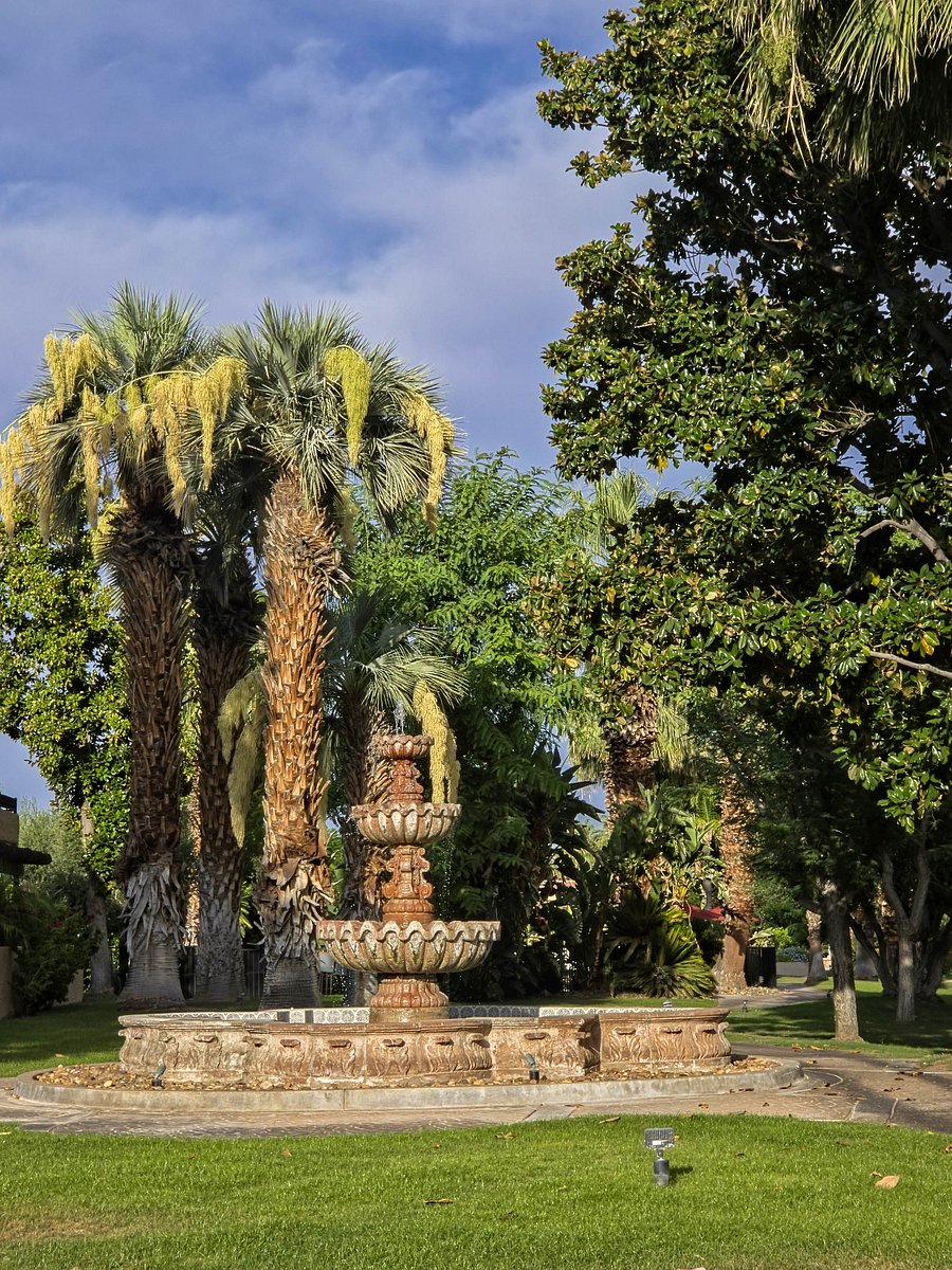Fountain across the street and path leading to other pools, clubhouse, and courts.