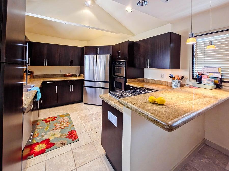 Kitchen entry. Refrigerator with water dispenser, water pitcher, and ice maker.