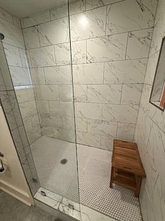 walk in shower with teak bench