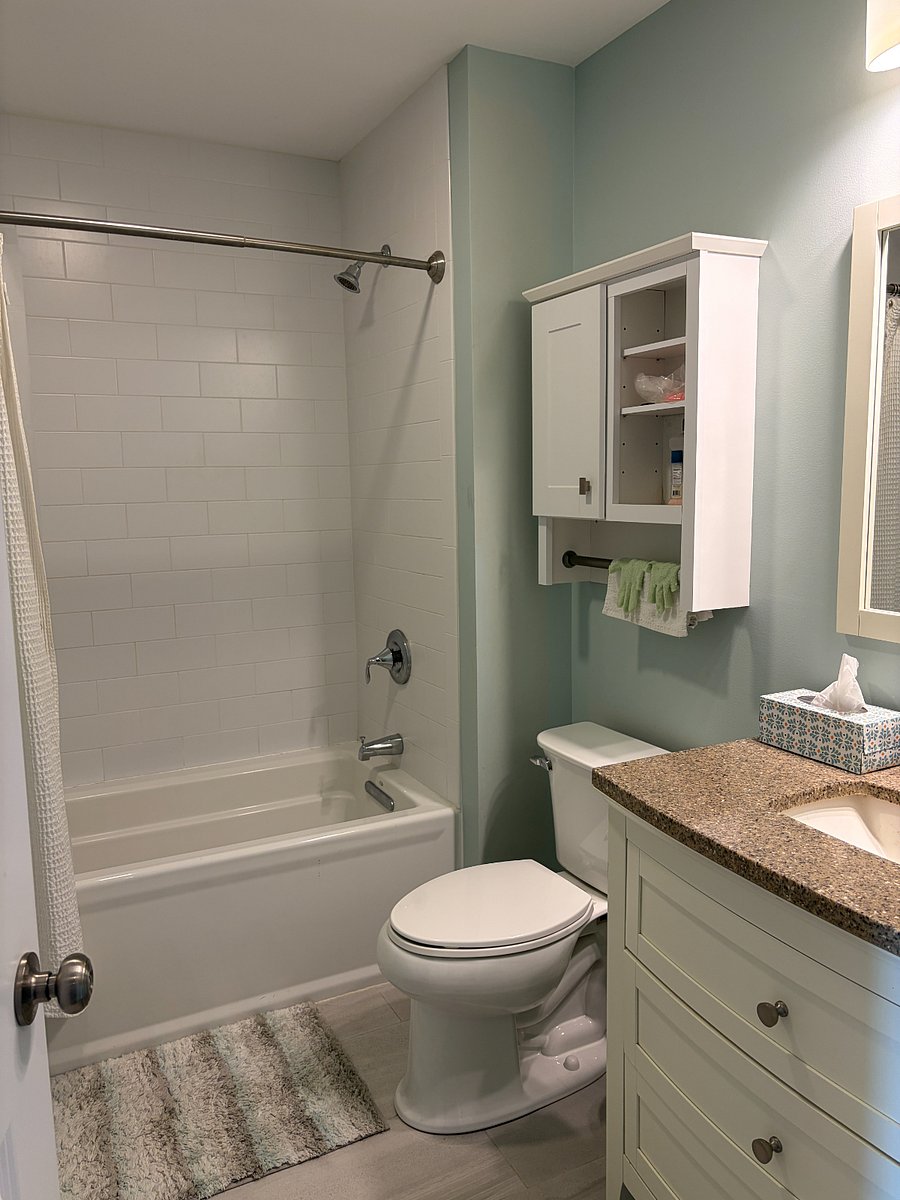 Full bathroom with tub/shower combination.