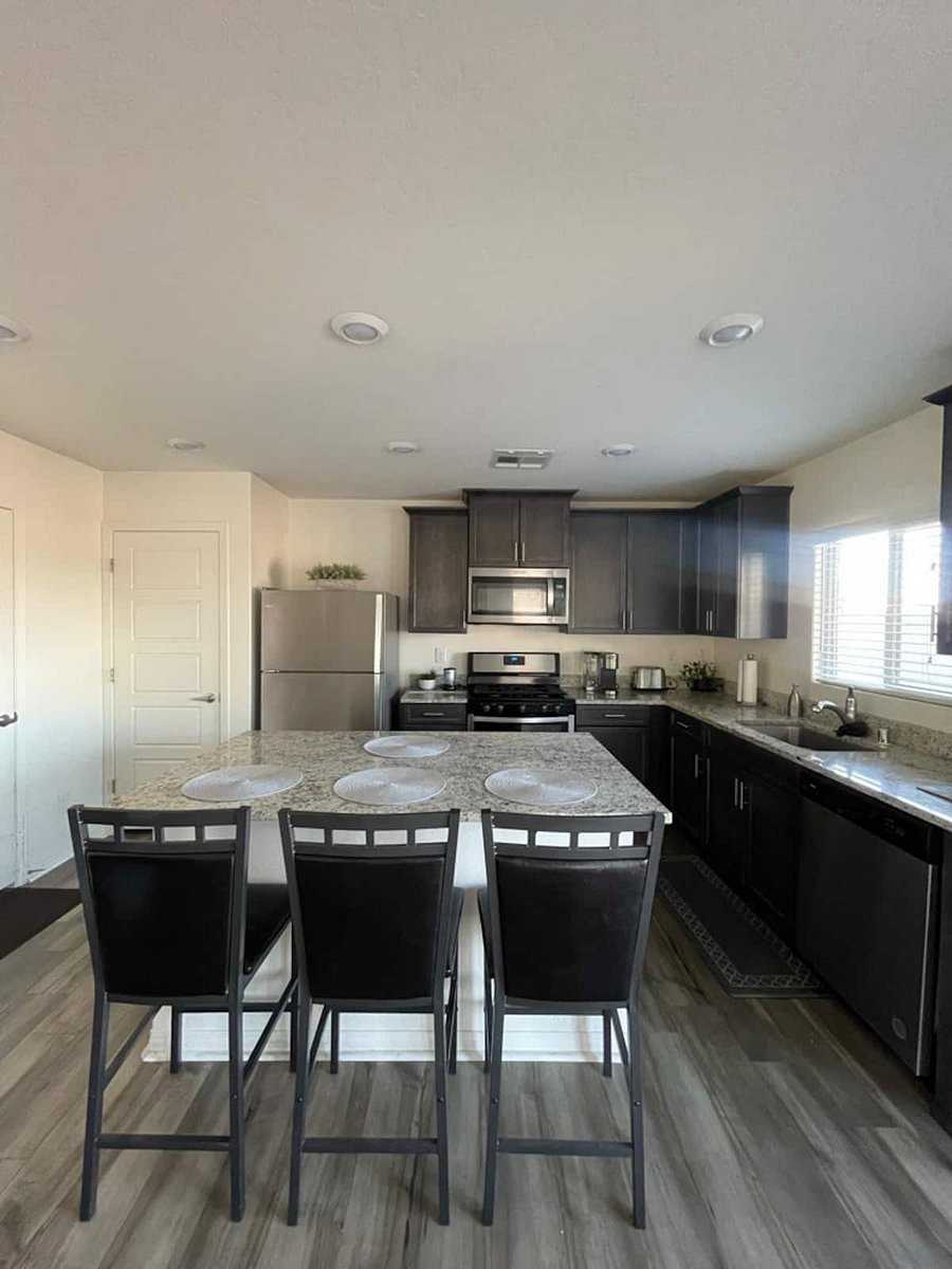 Fully equipped kitchen with dishwasher, stove, fridge, microwave