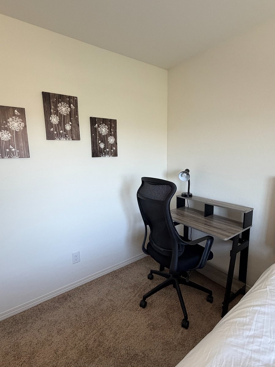 Bedroom 2 with workspace and office chair