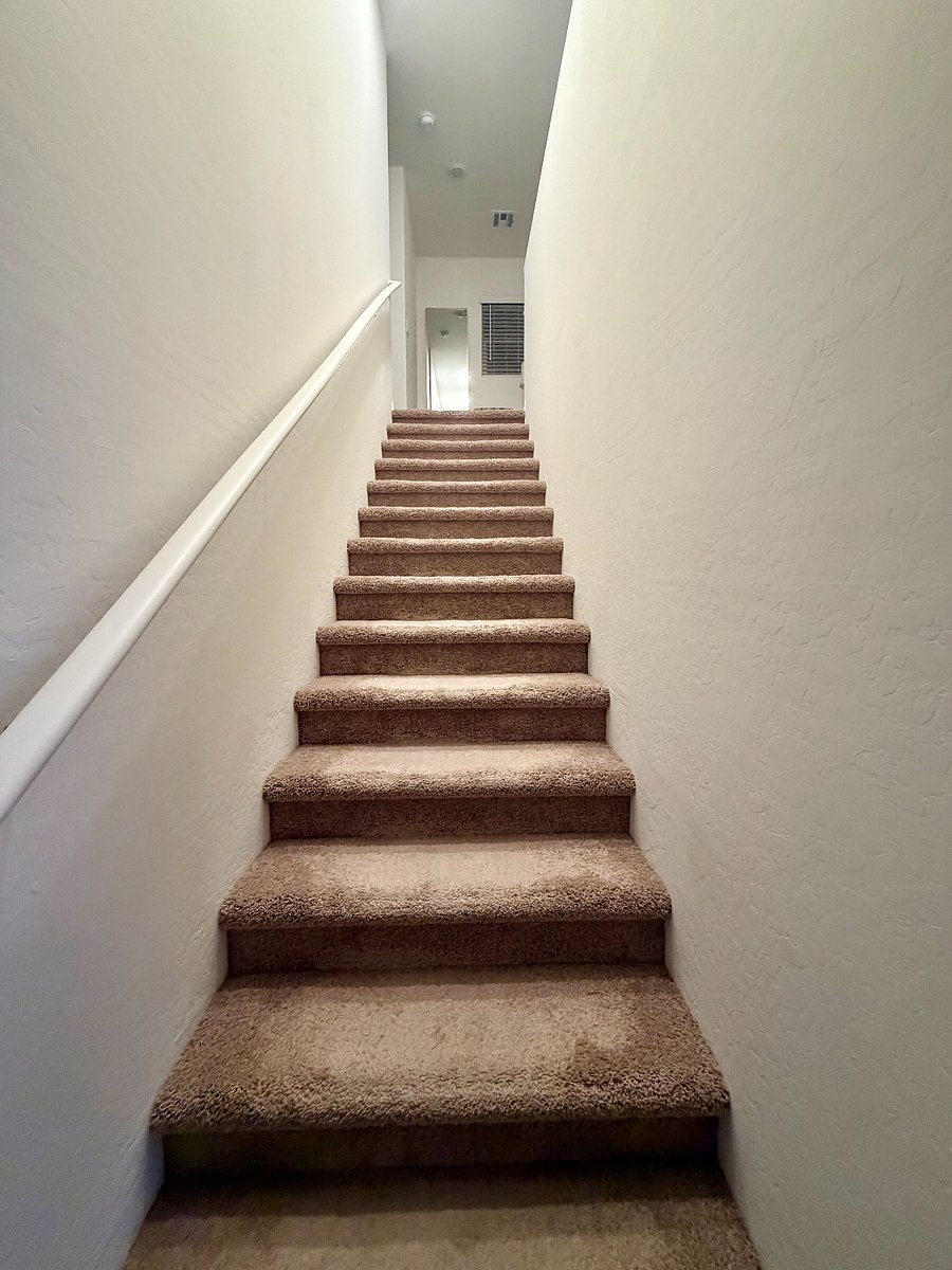 Stairs to three bedrooms upstairs
